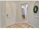 Elegant entryway with tile flooring and a view down a hallway at 20882 W Eastview Way, Buckeye, AZ 85396