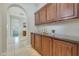 Elegant hallway with built-in cabinets and access to other rooms at 20882 W Eastview Way, Buckeye, AZ 85396