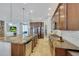 Modern kitchen with granite island and stainless steel appliances at 20882 W Eastview Way, Buckeye, AZ 85396