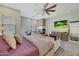 Luxurious main bedroom featuring a fireplace and large TV at 20882 W Eastview Way, Buckeye, AZ 85396