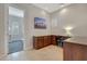 Home office with L-shaped desk and built-in cabinets at 20882 W Eastview Way, Buckeye, AZ 85396