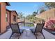 Relaxing pool area with lounge chairs and a small table at 20882 W Eastview Way, Buckeye, AZ 85396