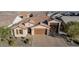 Aerial view of a single Gathering home with brown roof and garage at 21160 E Cattle Dr, Queen Creek, AZ 85142