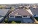 Aerial view of home's back, highlighting patio and yard at 21160 E Cattle Dr, Queen Creek, AZ 85142