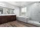 Spa-like bathroom with soaking tub and glass shower at 21160 E Cattle Dr, Queen Creek, AZ 85142