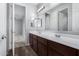 Double vanity bathroom with a view into bedroom at 21160 E Cattle Dr, Queen Creek, AZ 85142