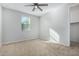 Well-lit bedroom with ceiling fan and closet at 21160 E Cattle Dr, Queen Creek, AZ 85142