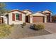 Beautiful home with a two-car garage and drought-tolerant landscaping at 21160 E Cattle Dr, Queen Creek, AZ 85142