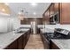 Modern kitchen with stainless steel appliances and granite countertops at 21160 E Cattle Dr, Queen Creek, AZ 85142