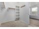 Spacious walk-in closet with shelves and hanging rods at 21160 E Cattle Dr, Queen Creek, AZ 85142