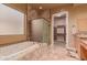 Bathroom with soaking tub, shower and walk-in closet at 213 E Summerside Rd, Phoenix, AZ 85042