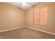 Bright bedroom with neutral walls and carpeted floors at 213 E Summerside Rd, Phoenix, AZ 85042