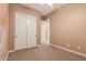 Bedroom with double door closet and neutral decor at 213 E Summerside Rd, Phoenix, AZ 85042