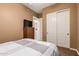 Bedroom with double door closet and a TV at 213 E Summerside Rd, Phoenix, AZ 85042