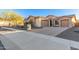 Beautiful stone elevation home with three car garage and desert landscaping at 213 E Summerside Rd, Phoenix, AZ 85042