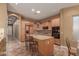 Spacious kitchen with light wood cabinets, granite counters, and island at 213 E Summerside Rd, Phoenix, AZ 85042