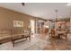 Open living room with neutral palette and views to the kitchen and dining area at 213 E Summerside Rd, Phoenix, AZ 85042