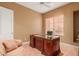 Home office with large desk and neutral walls at 213 E Summerside Rd, Phoenix, AZ 85042