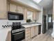 Modern kitchen with stainless steel appliances and light wood cabinets at 2358 S Pomo Ave, Apache Junction, AZ 85119