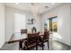 Bright dining area features a wood table and window seating at 2413 E Alta Vista Rd, Phoenix, AZ 85042