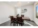 Bright dining area with a wood table and window seating at 2413 E Alta Vista Rd, Phoenix, AZ 85042