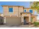 Two-story house with a two-car garage and landscaping at 2413 E Alta Vista Rd, Phoenix, AZ 85042