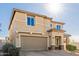 Two-story house with a two-car garage and stone accents at 2413 E Alta Vista Rd, Phoenix, AZ 85042