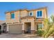 Two-story house with a two-car garage and stone accents at 2413 E Alta Vista Rd, Phoenix, AZ 85042