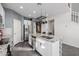 Modern kitchen with white cabinets and a large island at 2413 E Alta Vista Rd, Phoenix, AZ 85042