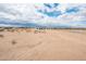 Expansive desert lot providing ample space and opportunities for personalized development at 25505 W Brookhart Way, Wittmann, AZ 85361
