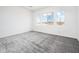 Bright bedroom features plush carpeting and multiple windows offering scenic views at 25505 W Brookhart Way, Wittmann, AZ 85361