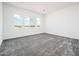 Spacious bedroom with carpet and large windows offering desert views at 25505 W Brookhart Way, Wittmann, AZ 85361