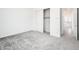 Bedroom featuring neutral tones and a sliding-door closet, providing a serene and organized space at 25505 W Brookhart Way, Wittmann, AZ 85361