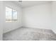 Carpeted bedroom with large window providing great natural light and outdoor views at 25505 W Brookhart Way, Wittmann, AZ 85361