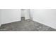 Carpeted bedroom with connected tiled area and closet space, offering modern living convenience at 25505 W Brookhart Way, Wittmann, AZ 85361