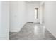 Bright entryway featuring gray tile flooring and a white door at 25505 W Brookhart Way, Wittmann, AZ 85361