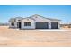 Charming single-story home with a three-car garage, desert landscaping, and a neutral color palette at 25505 W Brookhart Way, Wittmann, AZ 85361