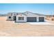 Charming single-story home with a three-car garage, desert landscaping, and a neutral color palette at 25505 W Brookhart Way, Wittmann, AZ 85361