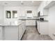 Modern eat-in kitchen featuring stainless steel appliances, white cabinets and granite countertops at 25505 W Brookhart Way, Wittmann, AZ 85361