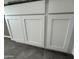 Detailed view of the pristine white kitchen cabinets in the newly constructed home at 25505 W Brookhart Way, Wittmann, AZ 85361