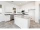 Bright kitchen featuring white cabinets, granite countertops, and stainless steel appliances at 25505 W Brookhart Way, Wittmann, AZ 85361