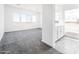 Spacious main bedroom with carpeted floors and ensuite bathroom at 25505 W Brookhart Way, Wittmann, AZ 85361