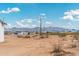 A street view of the neighborhood, with beautiful mountains as the backdrop at 25505 W Brookhart Way, Wittmann, AZ 85361