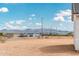 A street view of the neighborhood, highlighting clear blue skies and beautiful mountain backdrop at 25505 W Brookhart Way, Wittmann, AZ 85361