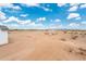 An image showcasing the backyard space, along with clear blue skies at 25505 W Brookhart Way, Wittmann, AZ 85361