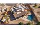 Aerial view of a house with solar panels and a pool in the backyard at 2731 E Laurel Ln, Phoenix, AZ 85028