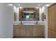 Bathroom with double sinks, granite countertop, and copper faucets at 2731 E Laurel Ln, Phoenix, AZ 85028