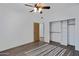 Bedroom with wood flooring and a built-in wall unit at 2731 E Laurel Ln, Phoenix, AZ 85028