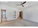 Spacious bedroom with built-in shelves and ceiling fan at 2731 E Laurel Ln, Phoenix, AZ 85028