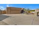 Curved driveway leading to a tan stucco house at 2731 E Laurel Ln, Phoenix, AZ 85028